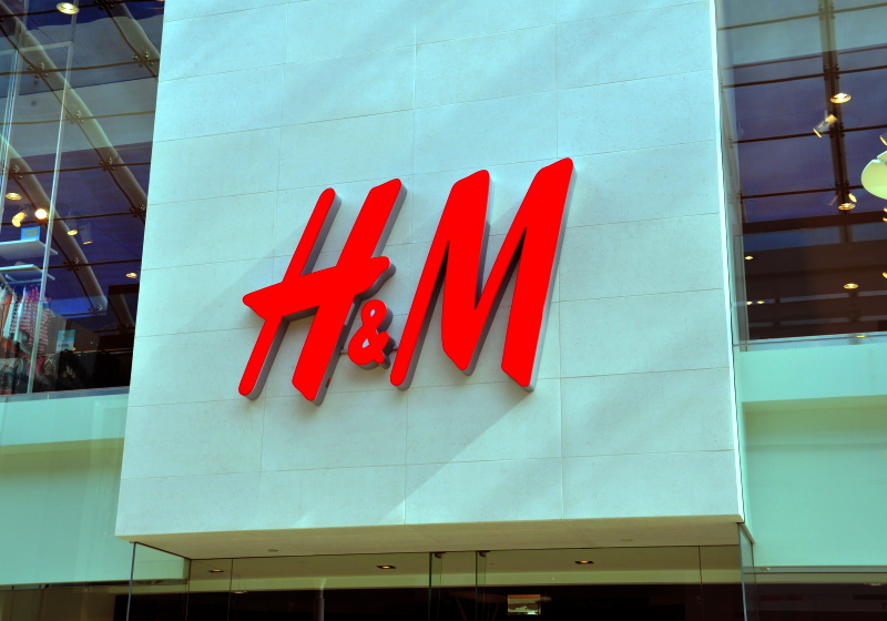A logo of fashion retailer H&M and the online shopping site Tmall.com of  Chinese e-commerce giant Alibaba Group is pictured at an H&M store in  Shangha Stock Photo - Alamy